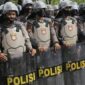 Ilustrasi Polisi mengamankan buru