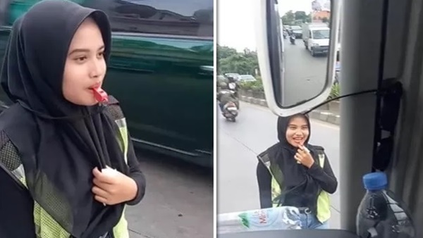 Tangkapan layar video – Juru parkir berhijab viral bikin netizen klepek-klepek